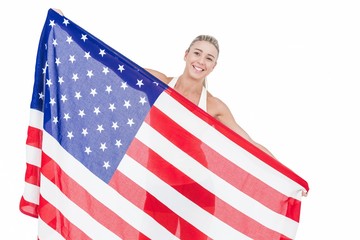 Female athlete holding American flag