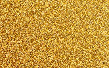 Vector golden glitter background. Luxury shimmering golden texture.
