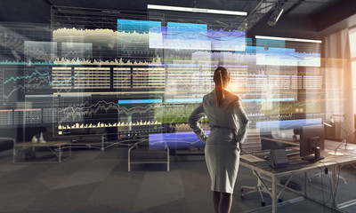 Obraz premium Businesswoman in modern office interior . Mixed media