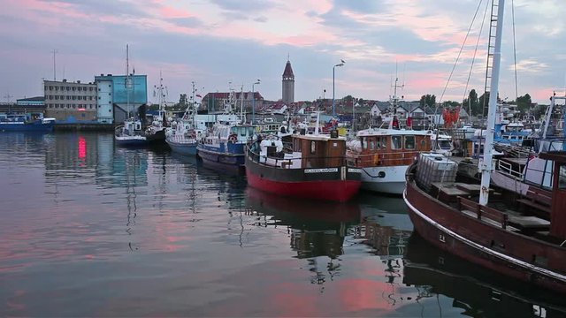 Fishing boats and ships at dusk in Wladyslawowo port, town at Baltic Sea in Poland