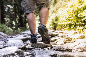 Man trekking on the rocky path - Powered by Adobe