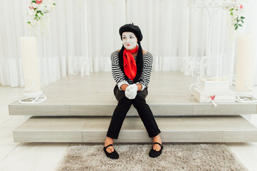 portrait of young mime girl with black hat