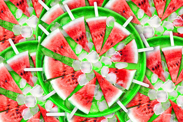 Slice of watermelon with ice cubes on a black background. Ice cream with the taste of watermelon. Sweet dessert. The summer mood.