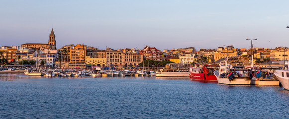 Fishing motor boat on the harbor in Palamos bay of Spain
