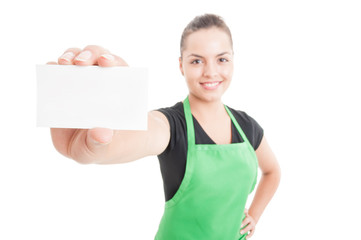 Successful female seller showing blank business card