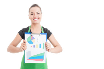 Successful sales woman holding clipboard with financial charts