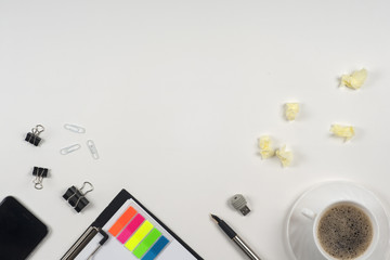 Office table desk with set of colorful supplies, white blank not