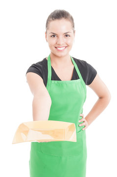 Beautiful smiling employee offering empty plate