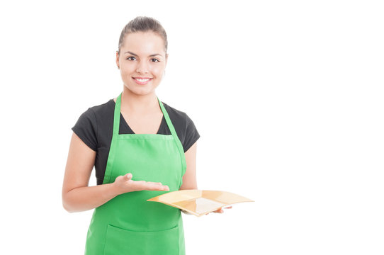 Attractive female employee showing empty dish