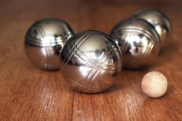 Petanque balls on wooden surface