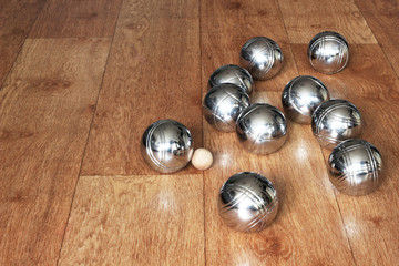 Petanque balls on wooden surface