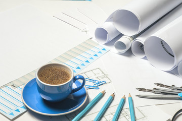 Workplace of architect - Architect rolls and plans. architectural plan,technical project drawing. Engineering tools view from the top. Construction background.