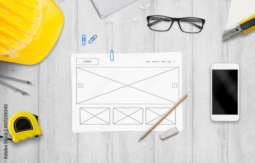 Poster Sketched idea od website on designer desk. Top view with construction tools.