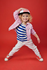 Portrait of a cute little girl in fashionable clothes. beautiful child