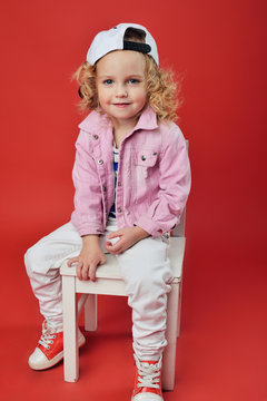 Portrait of a cute little girl in fashionable clothes. beautiful child