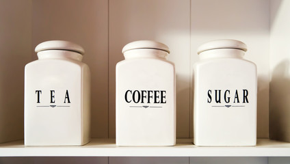 Modern tea coffee and sugar bowl in pantry shelf - obrazy, fototapety, plakaty