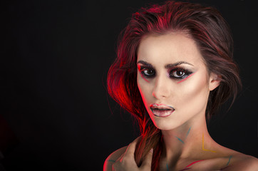 Fototapeta premium Girl with artistic colorful makeup
