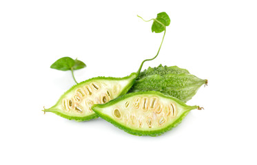 whole and half cut fresh mini bitter gourd with stem and seeds o