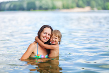 Fototapeta na wymiar Child swim in lake.