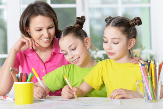 girls  with mother on lesson of art
