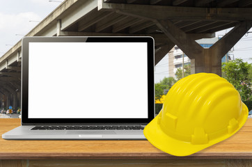 Safety helmet and laptop.