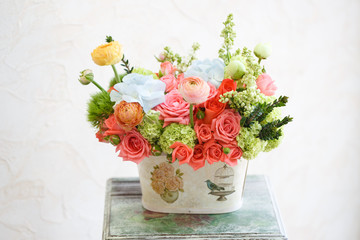 Many beautiful flowers in basket. Rose, peony, carnation and oth