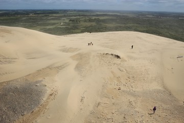 Denmark, North Jutland, Rubjerg Knude: View of a huge sand dune, some people wandering on it. Seen from the top of the lighthouse Rubjerg Knude fyr.