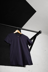 Team cotton t-shirt navy color presented in front of brick wall on pullbar