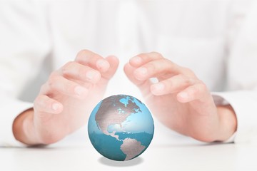 Hand and globe.