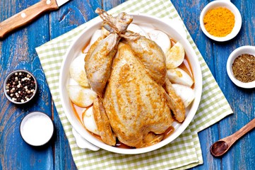 Raw chicken marinated with spices and onions.