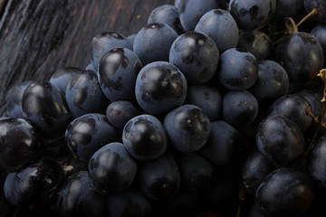 black grapes on wooden background