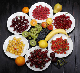 fruits and berries on wooden background