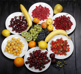 fruits and berries on wooden background