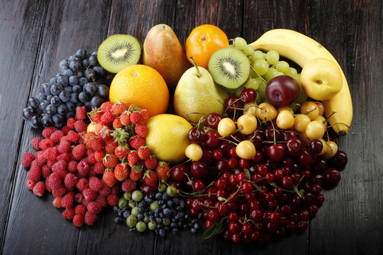 berries and fruits on wooden  background