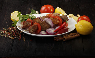 Fototapeta na wymiar grilled meat on wooden background