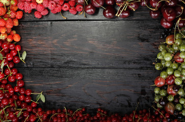 set of berries on wooden background