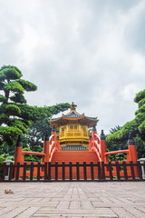Golden pavilion with Chinese style architecture in Nan Lian garden, Hong Kong.