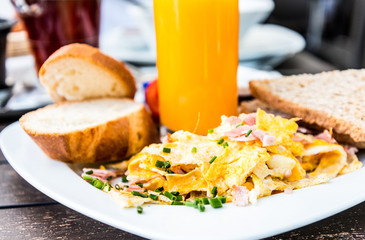 Breakfast with orange juice and fresh fruits on table