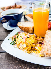 Breakfast with orange juice and fresh fruits on table