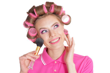 Beautiful woman in hair curlers