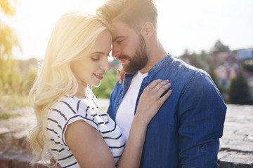 Fototapeta premium Loving and full of passion couple at sunset