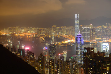 Hong Kong Skyline and Victoria Harbour at night from Victoria Peak on Hong Kong Island.