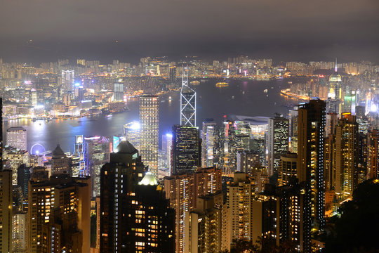 Hong Kong Skyline and Victoria Harbour at night from Victoria Peak on Hong Kong Island.