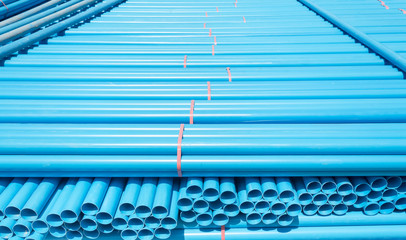 Obraz premium PVC pipes stacked in warehouse.