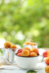 Ripe apricots fruit on white wooden table