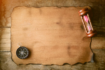 old paper, hourglass and compass for vintage background

