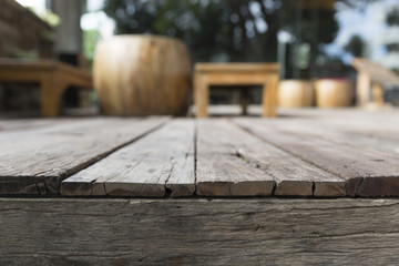 wooden floor with background of chair and table on terrace