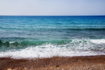 Pebbles Beach and Blue Sea