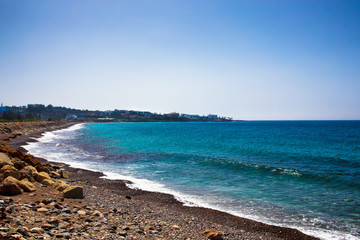 Pebbles Beach and Blue Sea. Toned