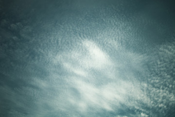 Obraz premium White clouds on a blue sky. Selective focus. Toned